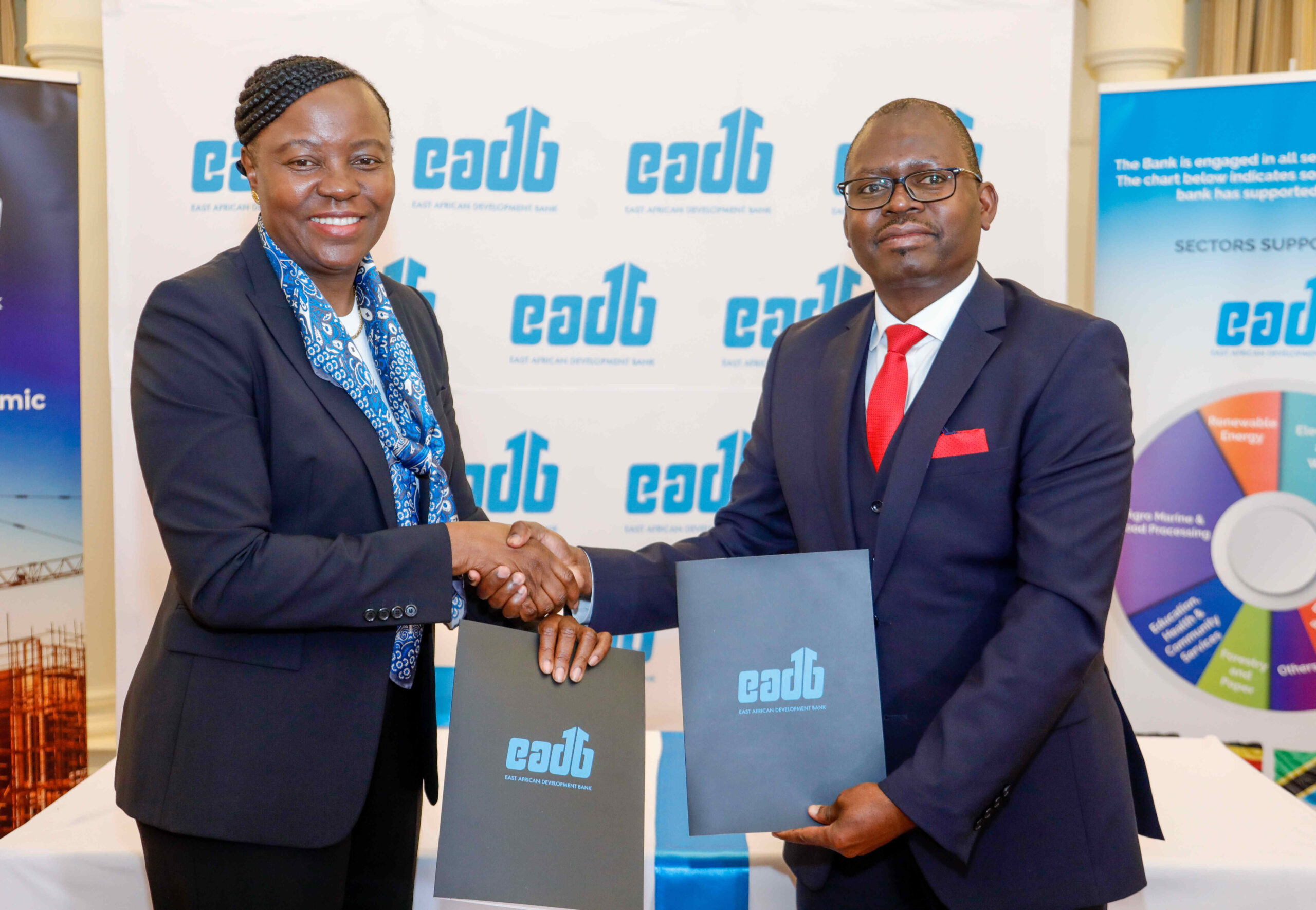 Vivienne Yeda - Director General, EADB (Left) and Peter Mugeni - Managing Director, HFC Limited (Right) signs an MOU Agreement during the East African Development Bank signing ceremony for its new program to bolster growth of SMEs in Kenya.