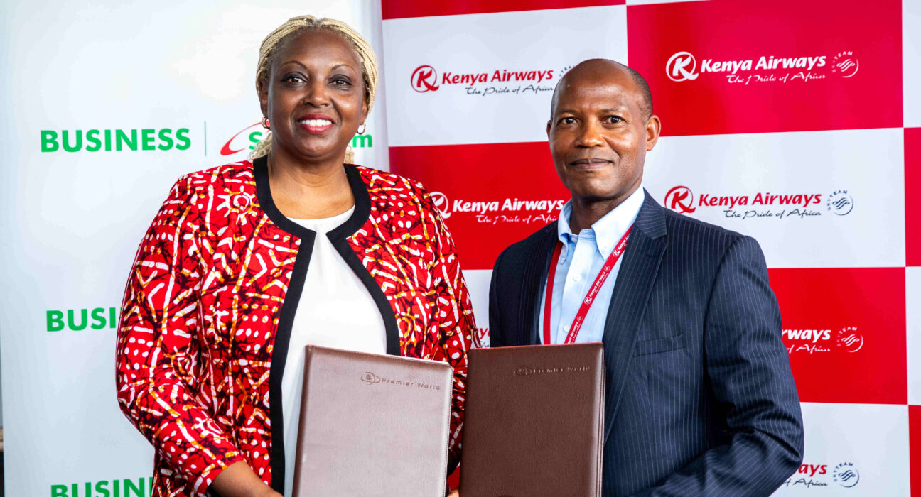 Cynthia Kropac, Head of Business at Safaricom signs deal with Fredrick Kitunga, Chief Information and Data Officer at Kenya Airways