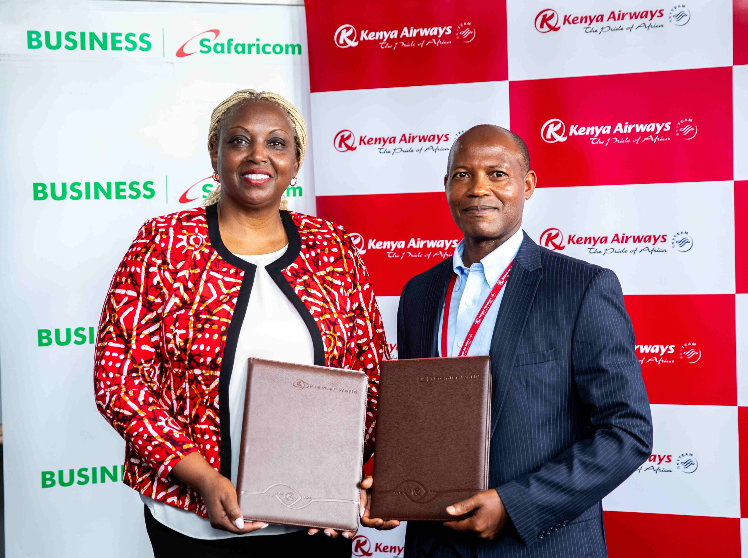 Cynthia Kropac, Head of Business at Safaricom signs deal with Fredrick Kitunga, Chief Information and Data Officer at Kenya Airways