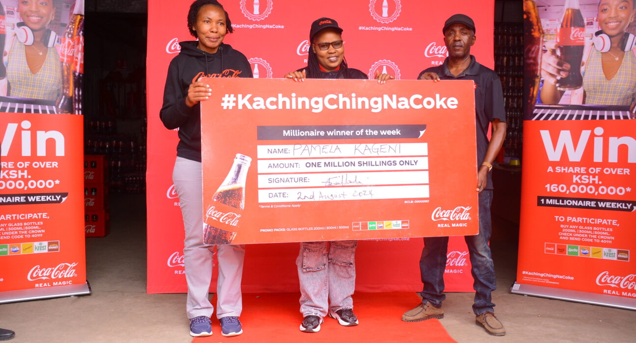 (L-R) Regional Trade Marketing Manager Nairobi, Coca- Cola Bottlers Kenya, Shilah Shitanda, Ksh 1Million winner Pamela Kageni from Nairobi and Area Sales Manager, Eastleigh District, Coca-Cola Bottlers Kenya, Ben Momanyi during the presentation of a cheque to one of the winners of the Kachingching na Coke campaign.
