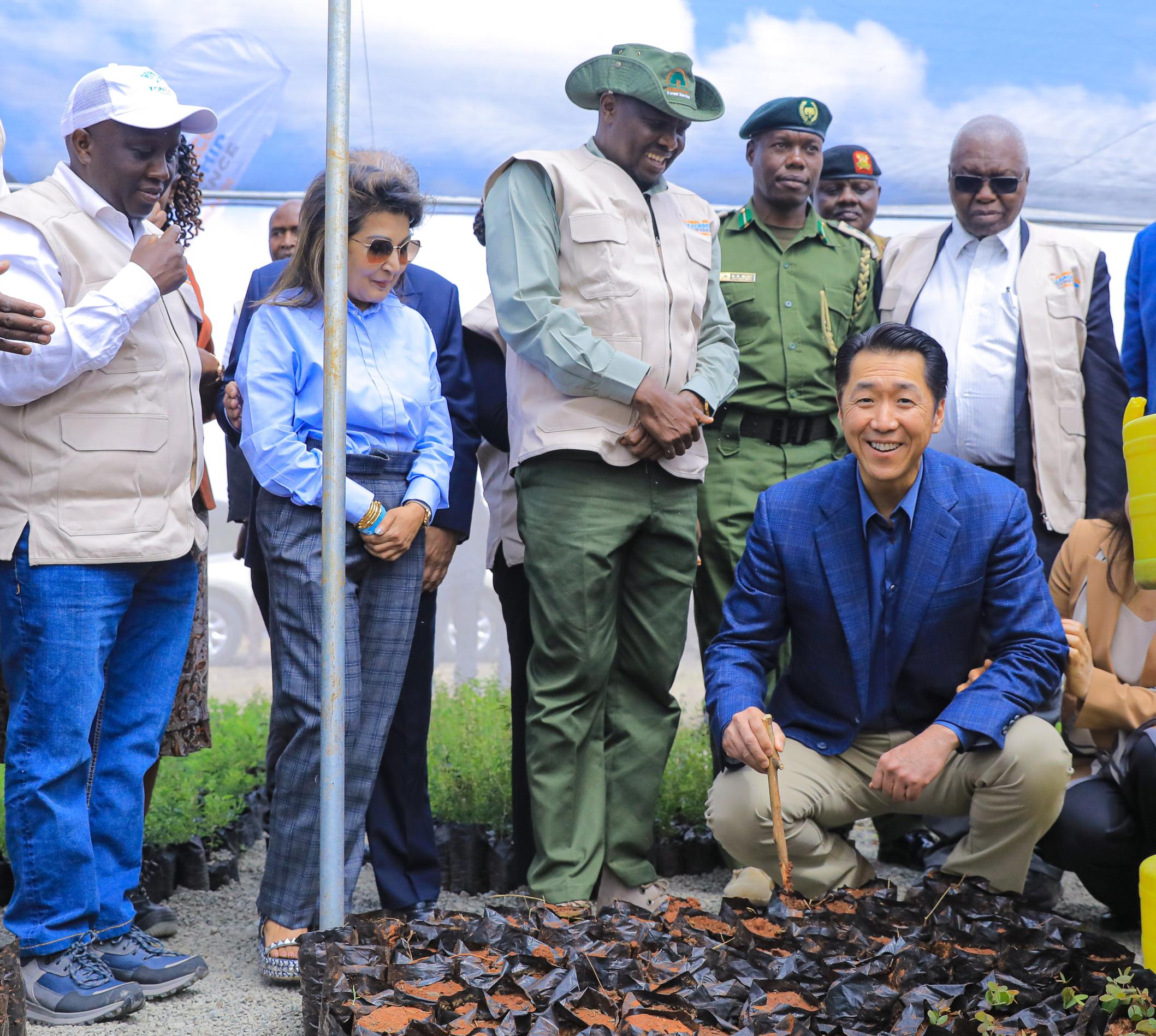 Dr. Hyun Jin Preston Moon, Founder and Chairman, Global Peace Foundation is all smiles after planting a tree seedling at the Chandaria Foundation Tree Nursery located at the Konza Technopolis. He is flanked from the left by John Tanui, Konza Technopolis Development Authority CEO, Priti Chandaria of Chandaria Foundation, Felix Koskei Head of Public Service, M.W Mutie, Kenya Forestry Service and Prof. Raphael Munavu, Chair Konza Technopolis.