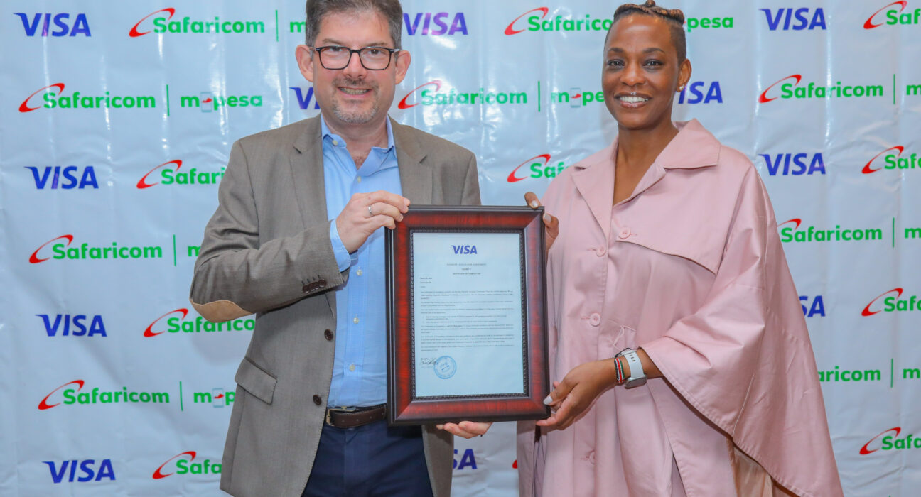 Visa’s SVP CEMEA Merchant Sales and Acquiring -Michael Berner hands over a certificate of completion to Safaricom’s , Chief Financial Services Officer- Esther Waititu during a Dinner held at Capital club to celebrate the partnership between Visa and Safaricom. The cirtificate certifies Safaricom PLC as a VISA CERTIFIED PAYMENT FACILITATOR IN KENYA.