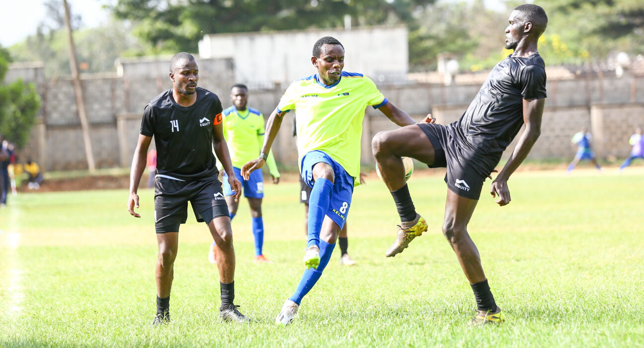 Simon Mwangi tussle for the ball with an opponent during a match against Cooperative Bank at the Nairobi Club on September 24, 2024.