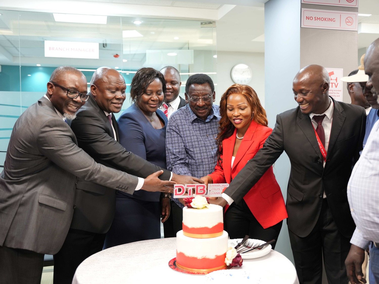 H.E James Orengo, Governor of Siaya County, leads the Diamond Trust Bank (DTB) executive team in cutting the cake during the official launch of the DTB Bondo branch in Bondo, Siaya County. The DTB team was represented by George Otiende, Director of Retail Banking; Dr. Kennedy Nyakomitta, Director of Commercial Banking; and Lillian Ngala, Director of Human Resources.