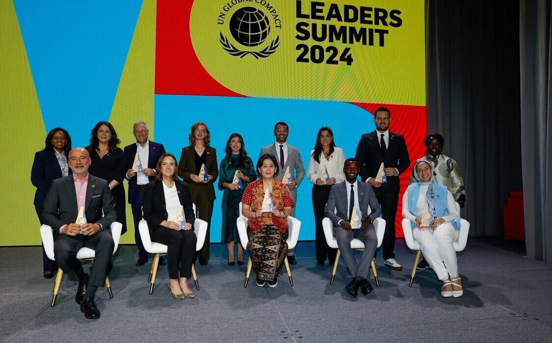 Kenya’s Kevin Getobai (seated, second from right) receives the 2024 SDG Pioneers award in the Africa SMEs Category at the Leaders Summit during the UN General Assembly in New York. Standing far left is UN Global Compact Executive Director, Sanda Ojiambo.