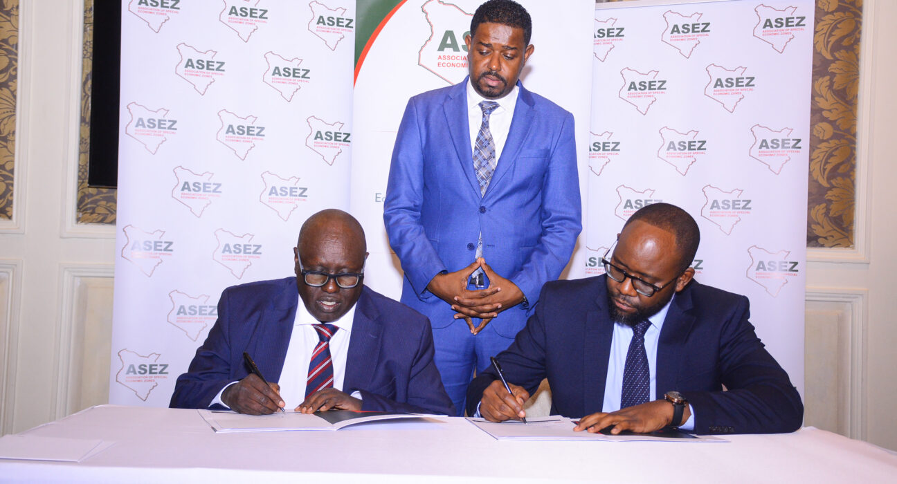 Hon. Abubakar Hassan Abubakar, Principal Secretary, State Department for Investment Promotion (Standing) looks on as Dr. David Langat, Chairman of ASEZ and Solomon Mahinda, Vice Chairman of ASEZ sign an agreement during the launch of the Association of Special Economic Zones. The association aims to establish a strong mandate to drive the future of Special Economic Zones (SEZs) in Kenya and attract both local and foreign investment.
