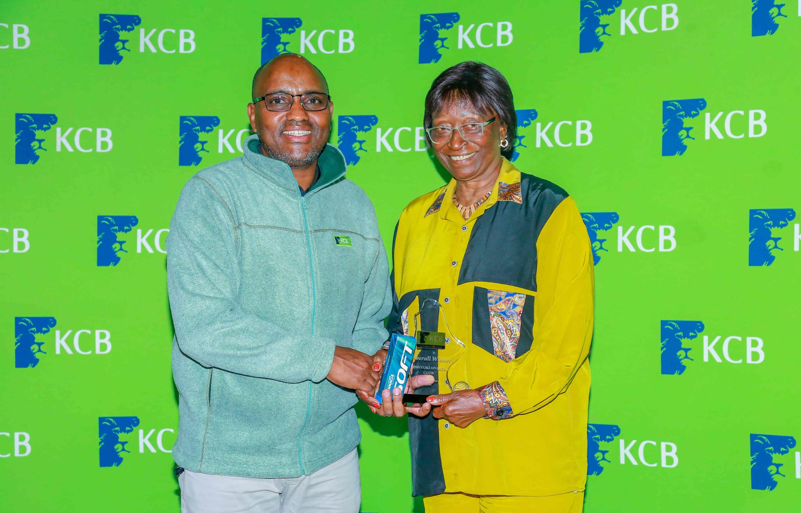 KCB Group CEO Paul Russo awards the overall winner 16th leg of the KCB East Africa Golf Tour Hellen Kurutu at the 9-hole Nanyuki Golf Course on September 7, 2024.
