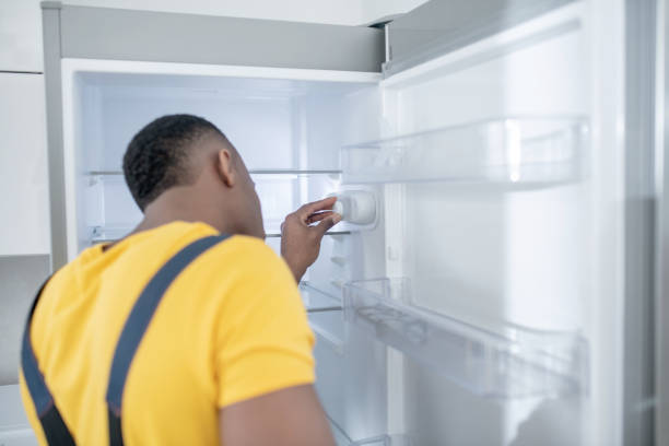 person using fridge stock