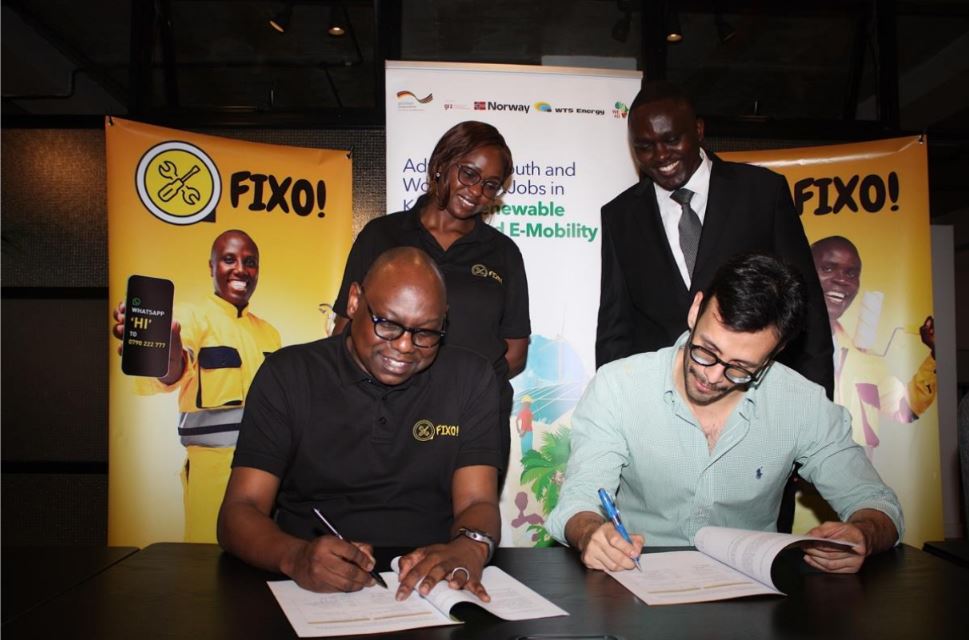 PARTNERSHIP: Levi Nyakundi (left), Chief Executive Officer for Fixo Solutions and Jose Rivera (right) General Manager for TMS Foundation formalize an agreement that will enable trained and certified solar installation technicians access employment opportunities through Fixo’s digital e-hailing platform. The platform, which was launched earlier this year, connects households and institutional clients to vetted and skilled handymen such as plumbers, painters, carpenters, electricians and welders. TMS Foundation runs training programes across East Africa, aimed at establishing a pool of trained professionals in renewable energy. The partnership with Fixo is expected to provide the newly trained technicians with a structured pathway to gainful employment. Looking on, are Julia Kwamboka, the Chief Growth Officer and Fixo Solutions and Wilson Maingi, the Program Manager at WTS Foundation.