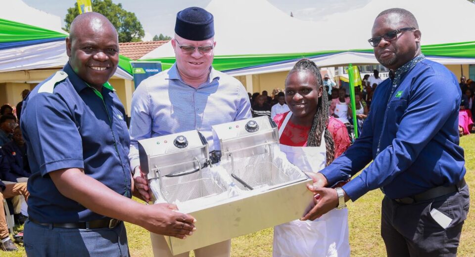 From left, KCB Foundation Deputy Chief of Party, Operations, Benard Barasa, Webuye East MP, Hon. Martin Pepela, and KCB Group HR Business Partner, Cleophas Ambira, hand over a toolkit to graduate Evelyn Vickey during the KCB Foundation graduation and toolkits handover ceremony held on 27th September 2025 in Bungoma County. The programme seeks to equip young people with practical skills and starter kits to enhance self-reliance and job creation.