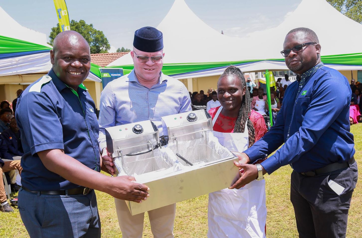 From left, KCB Foundation Deputy Chief of Party, Operations, Benard Barasa, Webuye East MP, Hon. Martin Pepela, and KCB Group HR Business Partner, Cleophas Ambira, hand over a toolkit to graduate Evelyn Vickey during the KCB Foundation graduation and toolkits handover ceremony held on 27th September 2025 in Bungoma County. The programme seeks to equip young people with practical skills and starter kits to enhance self-reliance and job creation.