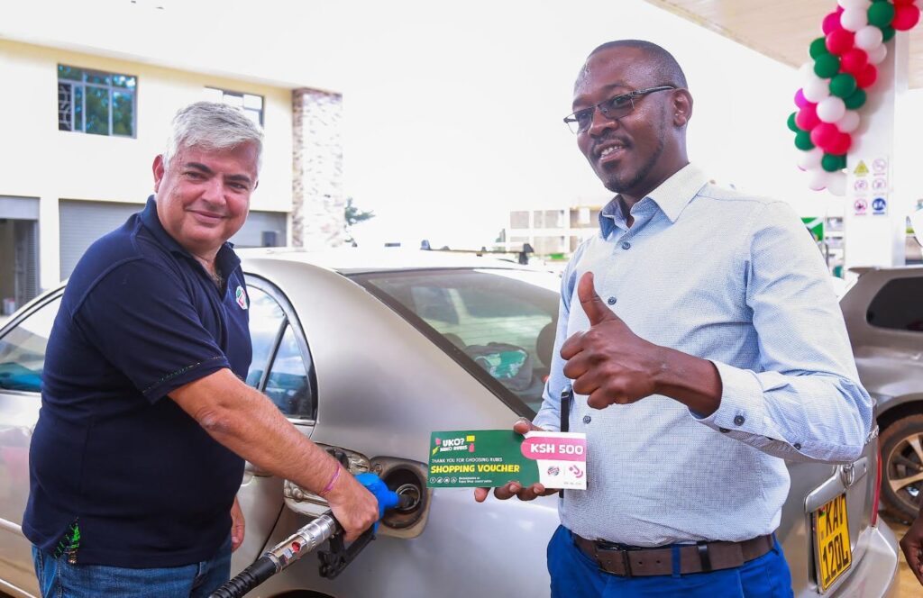 Rubis Energy East Africa CEO Olivier Sabrié (right) engages with a boda boda rider at the newly launched Rubis Champions Mall Petrol Station in Eldoret