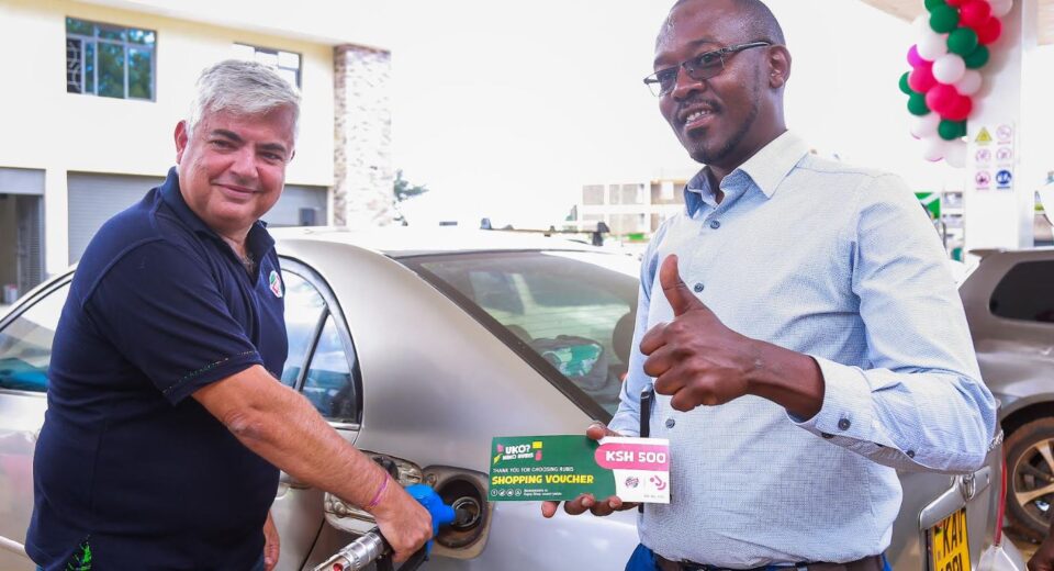 Rubis Energy East Africa CEO Olivier Sabrié (right) engages with a boda boda rider at the newly launched Rubis Champions Mall Petrol Station in Eldoret