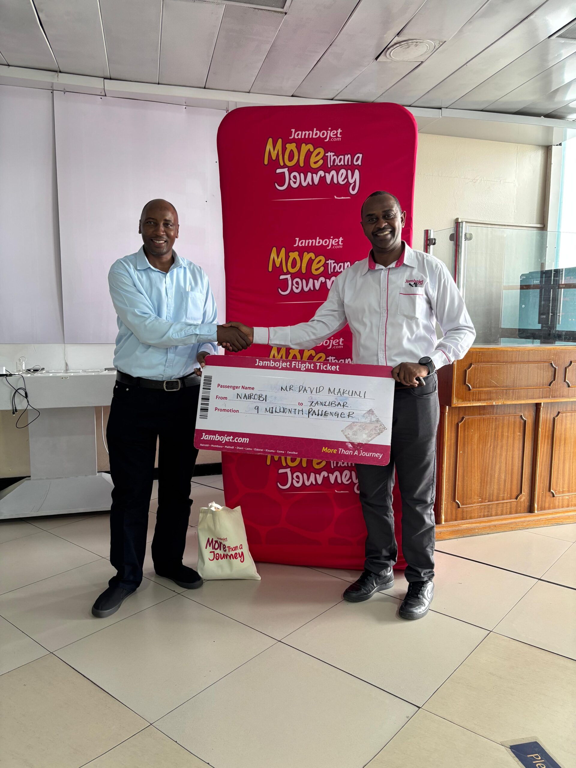 Jambojet CEO & MD, Mr. Karanja Ndegwa with its 9 millionth passenger, Mr. David Makumi