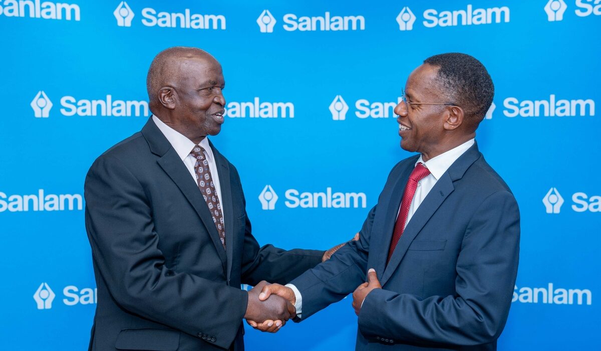 Sanlam Kenya PLC Chairman Dr John Simba (left) shares a light moment with the company's Group CEO Dr Patrick Tumbo (right) at a past event