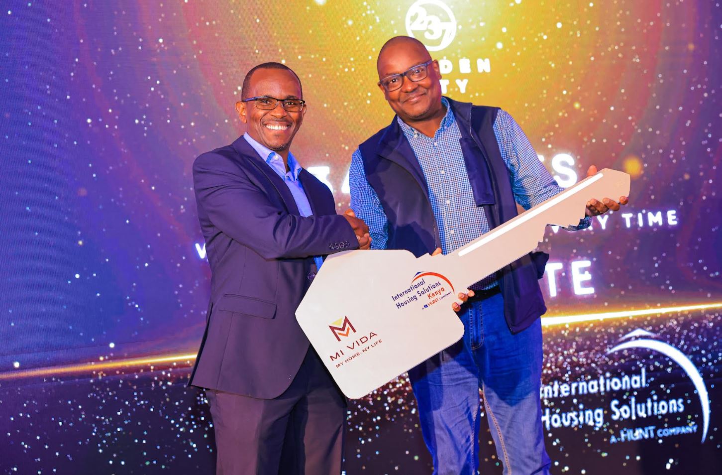 Mi Vida CEO Samuel Kariuki (Left) with International Housing Solutions Kenya MD Kioi Wamba during the handover of 200 complete housing Units.