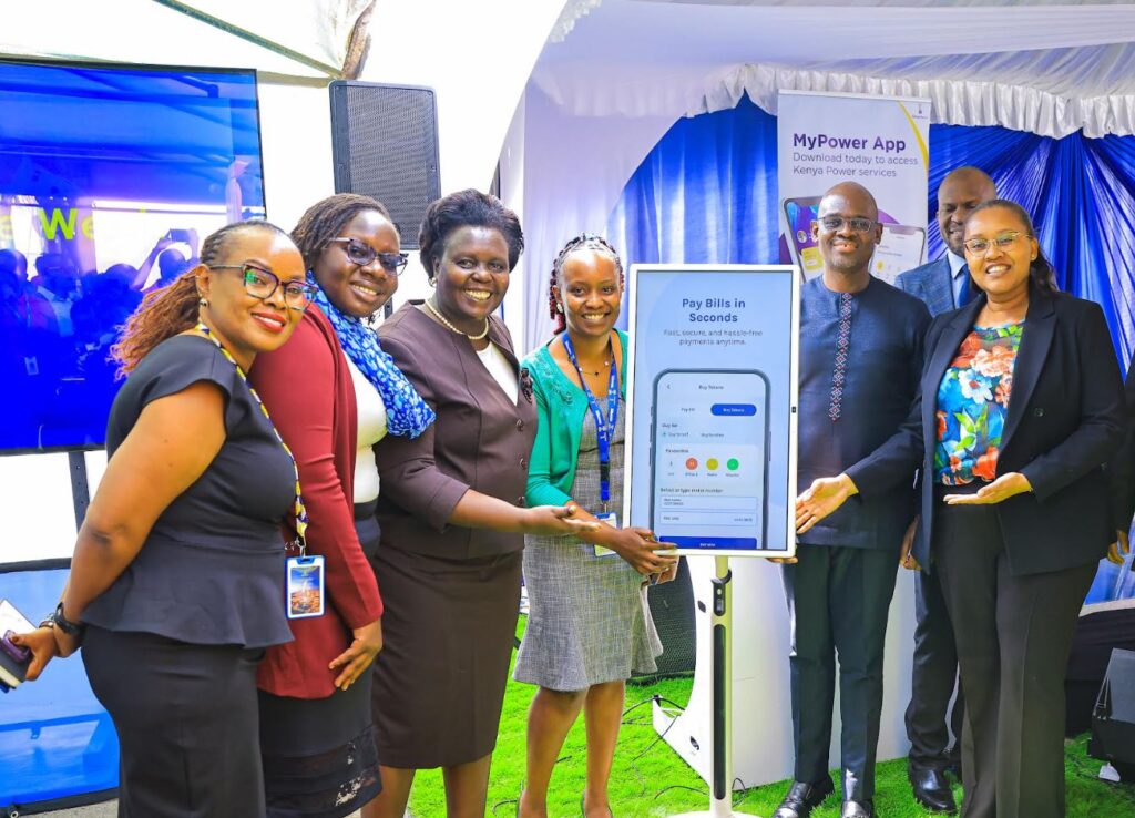 Kenya Power’s Board Director Ruth Muiruri (left) and the General Manager for Commercial Services & Sales Eng. Rosemary Oduor (right) present a gift to Mr. Deeyn Shah from Shrink Pack Limited. Mr Shah represented his Company during the launch of Kenya Power’s Digital Customer Service Platforms at Stima Plaza, Nairobi. Shrink Pack Limited is one of Kenya Power’s Large Power customers.