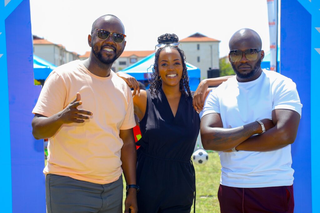 From L to R: Elisha Kamau, Public Relations Manager at MultiChoice Kenya, Evelyne Gitonga who plays Natasha on Lazizi and Alex Khayo who plays Sting on Qware pose for a photo during during the MultiChoice ALL I Want hii Krisi Festival Activation at Nyayo Estate.