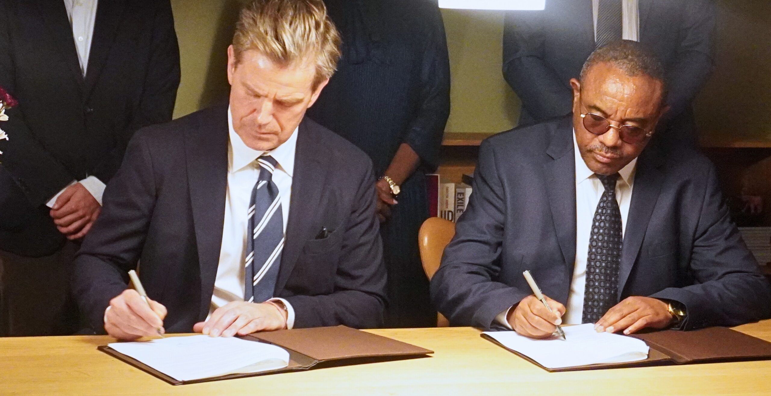 Right: TMA Board Chair and former Prime Minister of Ethiopia, H.E. Hailemariam Desalegn Boshe, and the Danish Ambassador to Kenya, H.E. Stephan Schønemann, signing the agreement.
