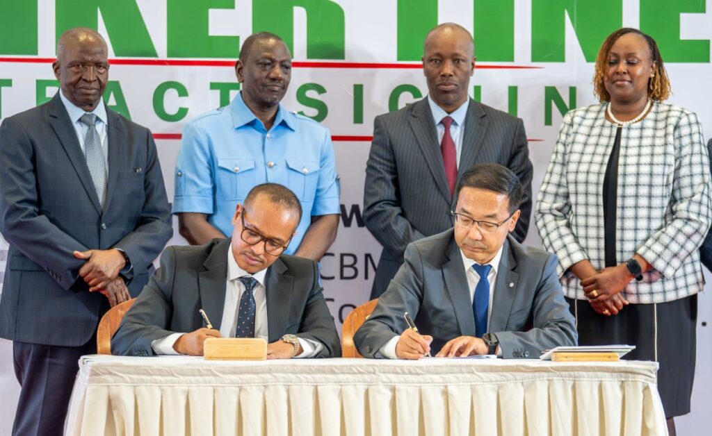 Amsons Group Managing Director Mr Edha Nahdi left and Sinoma CBMI Chairman Mr Zhang Sicai signing the US$250 million Matuga Clinker Factory Construction contract