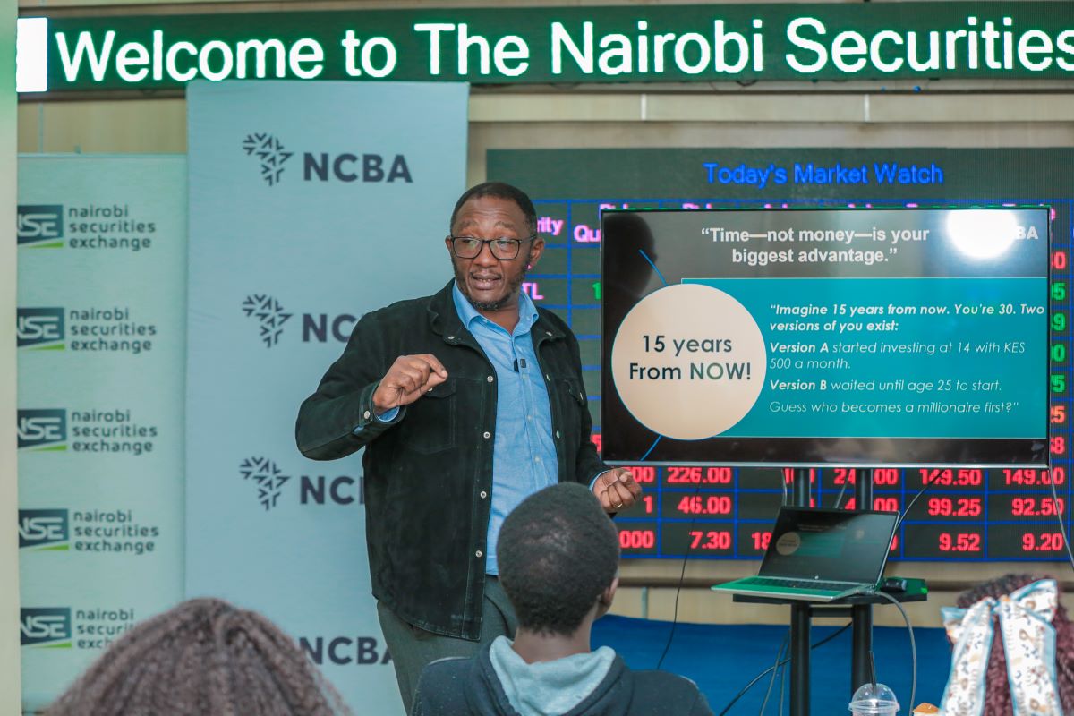 Samuel Gichohi, Head of Business Development, NCBA Investment Bank, taking the teens through Online Share Trading during the NCBA and Abojani Teens Financial Literacy and Early Investor Empowerment Workshop at the Nairobi Securities Exchange.