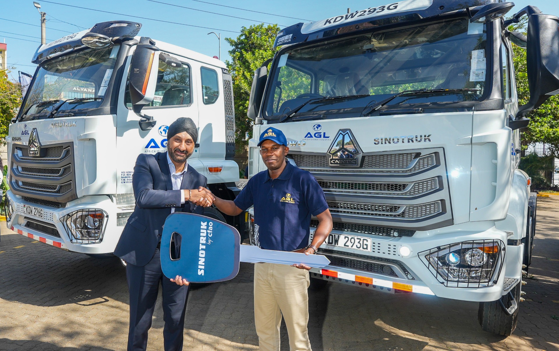 From Left - Managing Director, Africa Global Logistics Kenya, Martin Mwangi and CFAO Mobility Kenya, Managing Director, Arvinder Reel inside the cabin of one of the 32 new Sinotruks during the official handover ceremony.