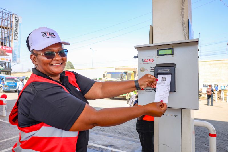 KRA Chief Manager for eTIMS Ms Hakamba Wangwe displays an eTIMS receipt froma petrol station